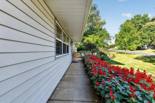 The walkway to the main door is paved with beautiful perennials.