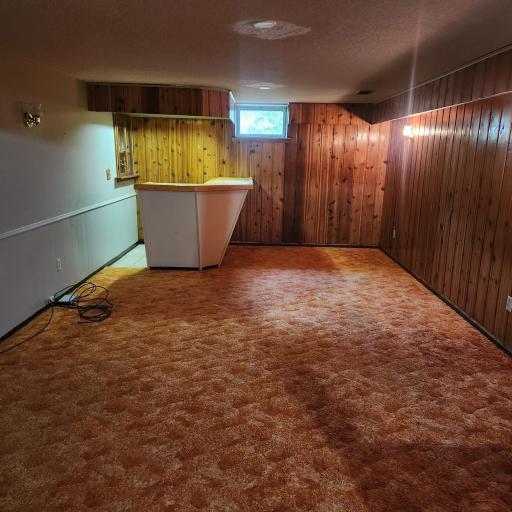 Lower level family room adjoins additional rec area and 3/4 bath