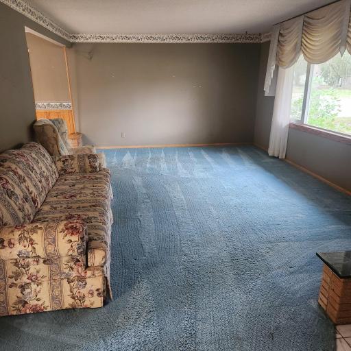 Spacious living room with Large picture window. Windows new in 2025 !