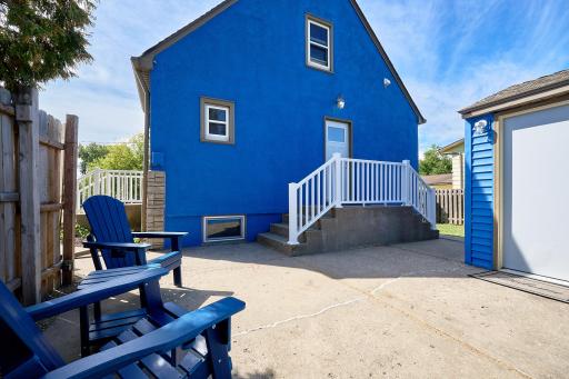Secluded patio between the garage & house