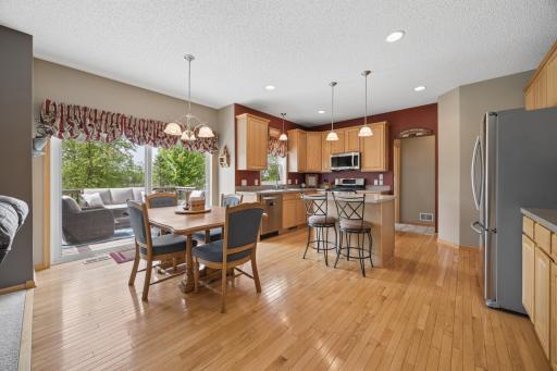 The open-concept main level is designed for easy living and entertaining, seamlessly connecting the kitchen, informal dining area, and inviting living room. Step outside to the deck for effortless indoor-outdoor gatherings and relaxation.