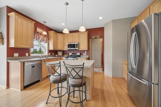 The heart of the home, this spacious kitchen offers abundant cabinetry, a versatile center island, and plenty of room to cook and gather. Enjoy the added convenience of a gas range, dishwasher, and microwave—all new in 2021.