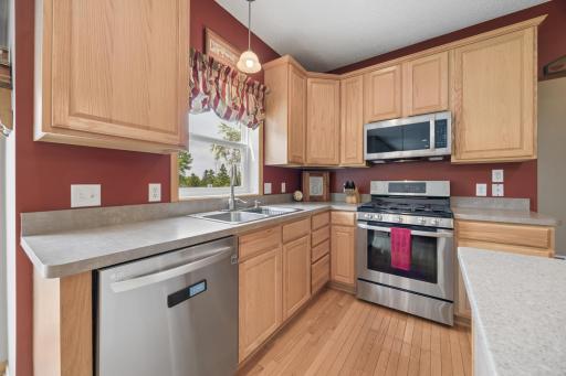 The kitchen shines with newer stainless steel LG appliances, including a gas range, dishwasher, and microwave, all updated in 2021. A stylish and functional upgrade that makes everyday cooking and entertaining a breeze.