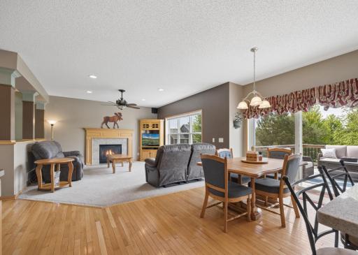 The inviting informal dining area creates a natural hub between the kitchen and living room, with easy access to the deck. Perfect for casual meals, morning coffee, and entertaining while keeping everyone connected.
