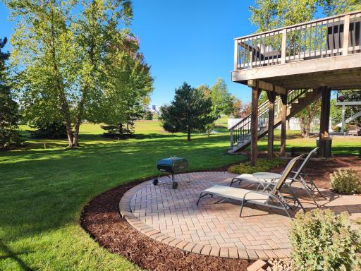 Unwind in the peaceful backyard and soak up the sunshine on the custom paver patio. With space for comfortable seating and evening bonfires, this inviting outdoor retreat is perfect for relaxing, entertaining, and making memories.