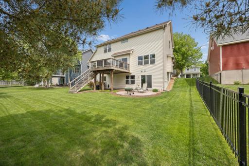 A backyard made for enjoying the outdoors! The expansive, level yard features mature trees, a deck, and paver patio, while backing to Linwood Park amenities for added space, scenery, and recreation right outside your door.