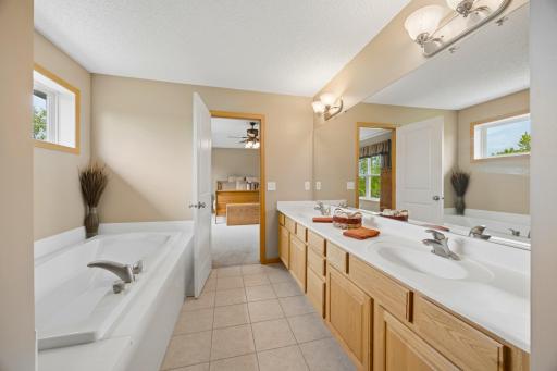The perfect place to unwind! Enjoy the large soaking tub, double vanity, and separate shower