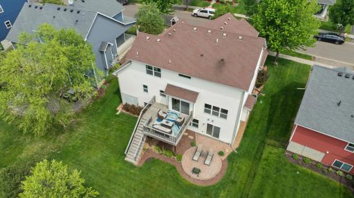 Designed for outdoor entertaining, this expansive level backyard features a spacious deck and paver patio—ideal for grilling, dining, and gathering with friends. Mature trees create a beautiful backdrop, with Linwood Park amenities just beyond.