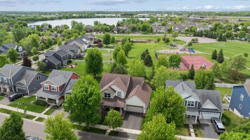 Prime location meets everyday convenience! From this aerial view, see how close the home is to Linwood Park, Towne Lakes Activity Center, community pool, walking paths, dog park, and more—all just an easy stroll away.