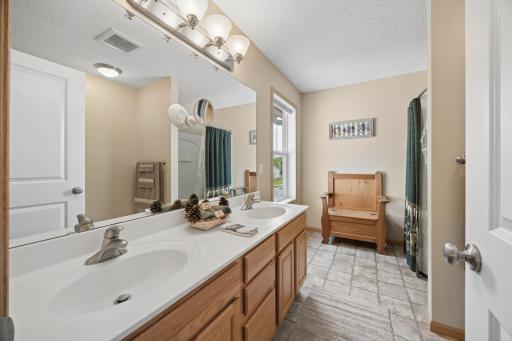 The upper-level full bath combines style and function with a spacious double vanity and abundant storage. Plenty of room for everyday essentials keeps busy mornings organized, while the generous layout adds comfort and convenience.