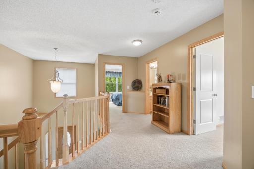 Open hallway connects the 3 bedrooms on the upper level