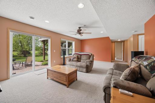 Enjoy a versatile finished lower level with walkout access to a custom paver patio. Plenty of room for an entertainment center and gaming table, plus great natural light and abundant storage for added convenience.