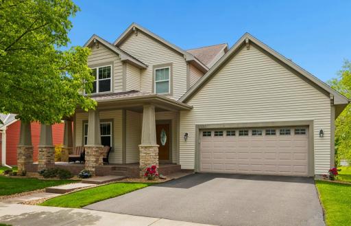 Beautiful curb appeal welcomes you with a charming wraparound front porch, mature landscaping, and a picturesque neighborhood setting. The spacious 3-stall garage, including a 3rd tandem stall, offers exceptional parking, storage, and flexibility.