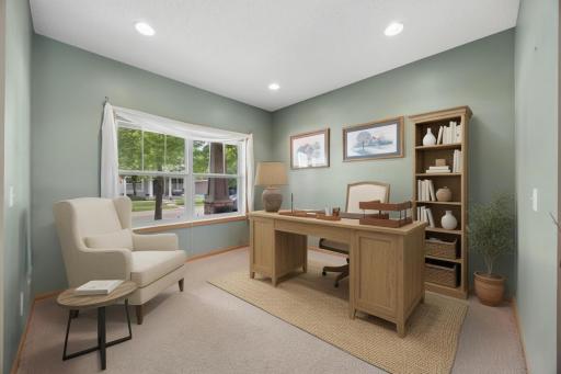 A stylish and versatile home office or flex room offering a bright, welcoming workspace with abundant natural light, and plenty of room to work, create, or unwind. (Shown virtually staged)