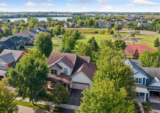 Prime location meets everyday convenience! From this aerial view, see how close the home is to Linwood Park, Towne Lakes Activity Center, community pool, walking paths, dog park, and moreâall just an easy stroll away.