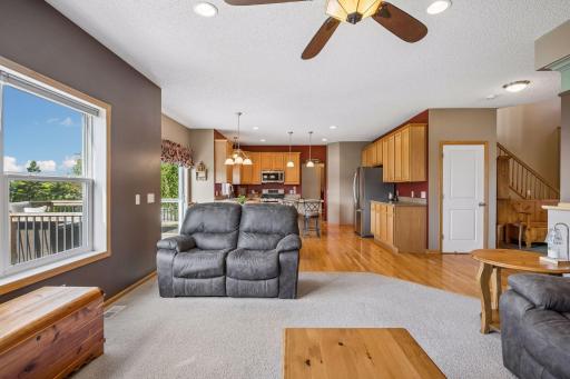 Relax and unwind in the spacious family room, featuring a cozy gas fireplace and large windows that frame peaceful backyard views. A welcoming space for movie nights, quiet evenings, and gathering with family and friends.