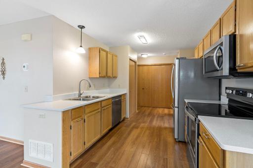 Kitchen with quartz counters and stainless steel appliances