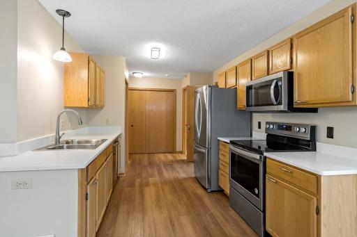 Kitchen with quartz counters and stainless steel appliances