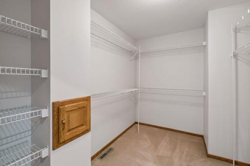 Walk in closet with laundry chute