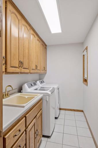 Well appointed laundry room with additional cabinetry (not shown) - location off the mudroom