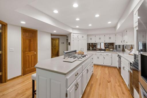 Pantry door to the left, sight lines to the amusement room - this kitchen is loaded with storage space!