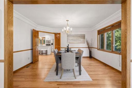 Wide crown molding and double doors to kitchen