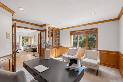 An office with built ins, French doors - located off the foyer