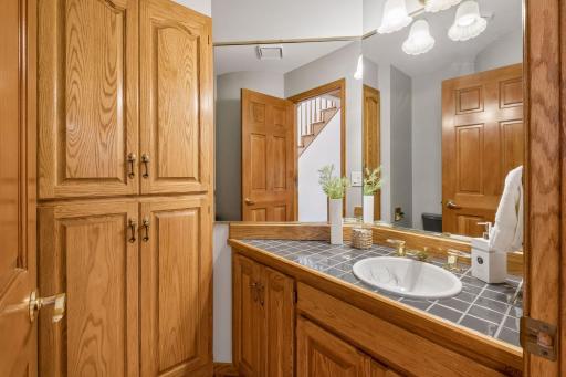 Powder room located off the hallway