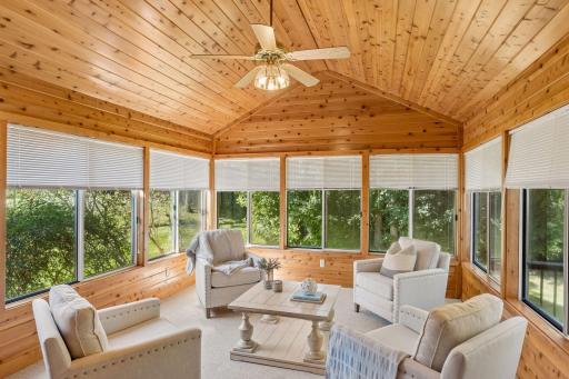 The sunroom offers great views and a lovely space to curl up with a great book. Door to deck allows easy access to back yard.