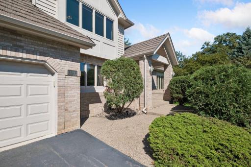 A brick and cedar exterior plus metal roof