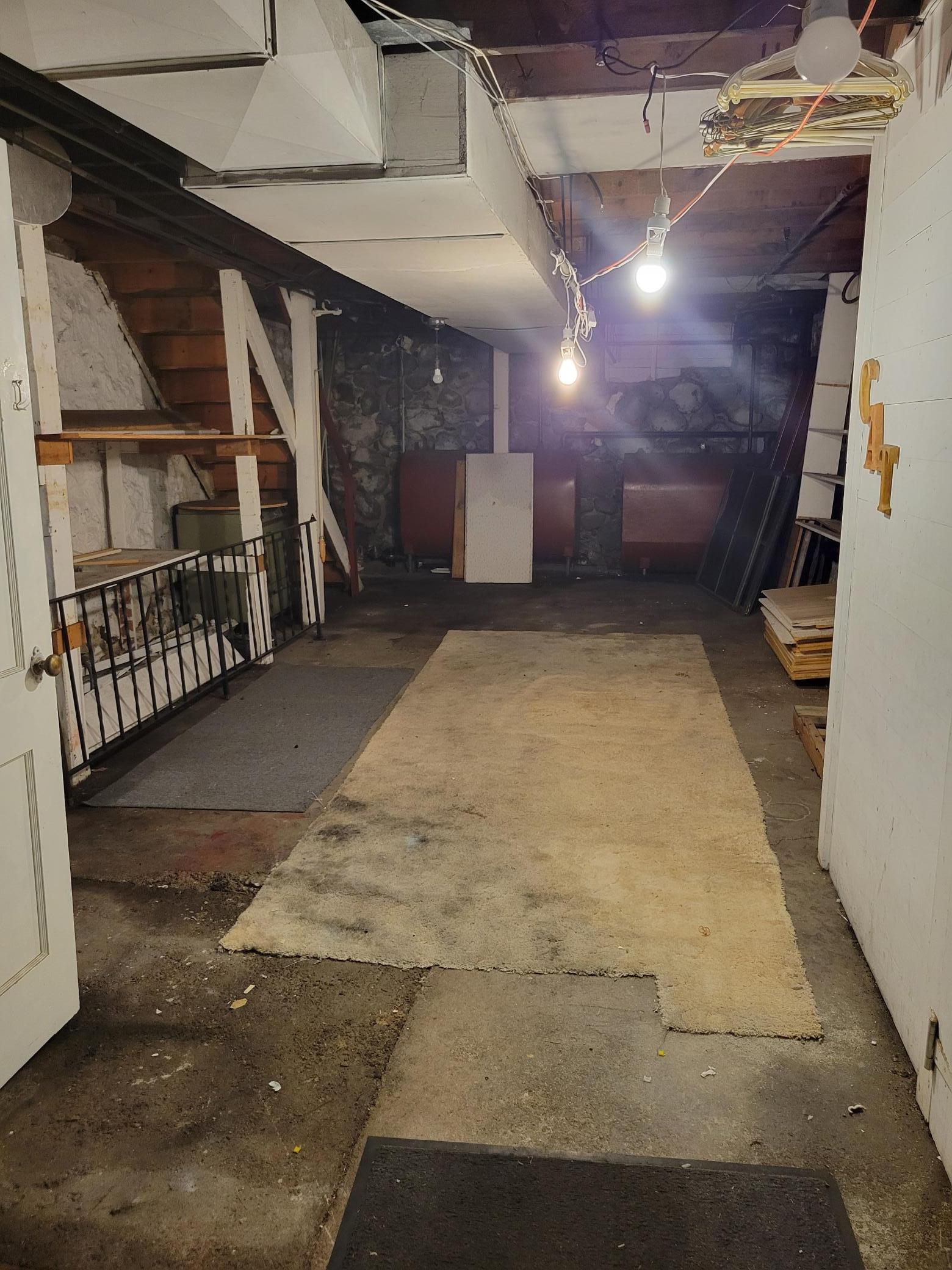 Storage area a few steps up from furnace room