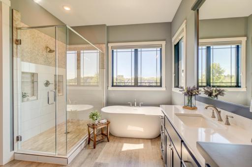 Indulge in the beauty of this gorgeous walk-in tiled shower and large soaking tub, thoughtfully designed to bring a spa-like feel to the everyday routine!
