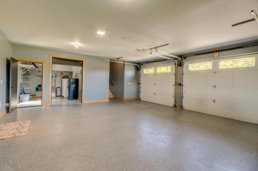 Heated 3.5-stall garage features durable epoxy flooring and large workbench!