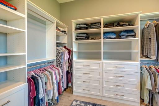 Walk-in primary closet features built-in organizers for convenient, customized storage!