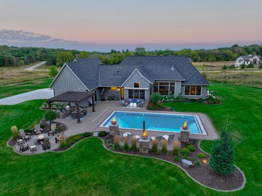Welcome to 5580 Oakridge Trl S - Former Parade of Homes model, custom built by Parent Builders with exceptional attention to detail!