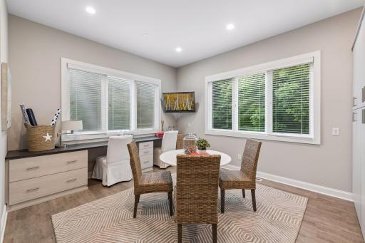 Home office is located on the main level of the home and has large walk in closet and plenty of cabinets. Peaceful views of the back yard.