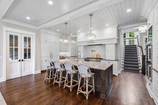 Just off the kitchen through the double doors is your fireside room with fireplace.