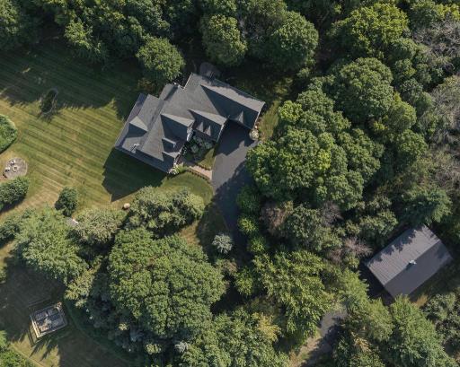 Seven acres of lush landscapes, mature trees, walking trails and apple orchards. Got an RV, Boat, side by sides? You property is a true lakes country experience perfect for car collectors, arborists, boating or off road recreation.