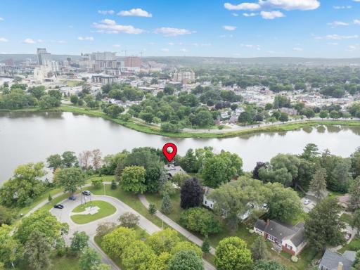Situated on the shore of Silver Lake, looking to the Rochester Skyline, this Ellerbe designed home is one of a kind.