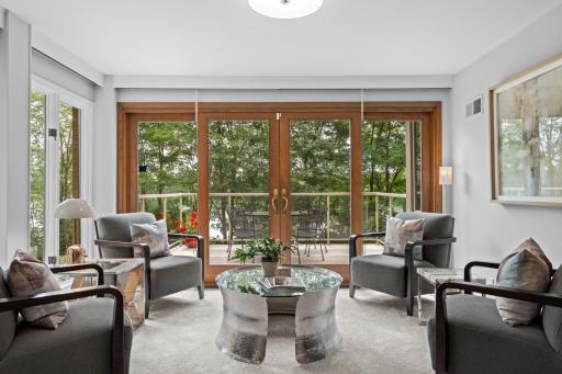 Walls of windows in every room invite the lush green and natural light in.