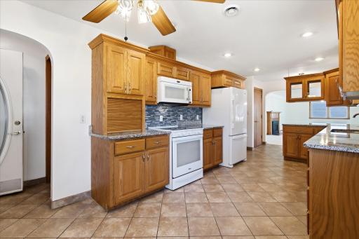 Newer range and a new fridge in the kitchen area.