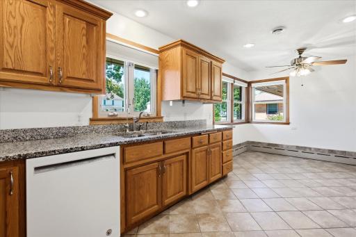 Updated cabinetry with kitchen window. Blinds are remotely controlled.