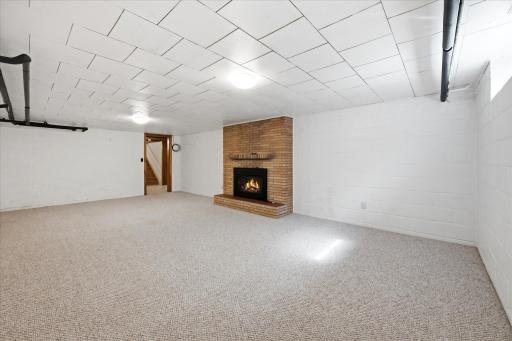 Family room in the lower level with fireplace