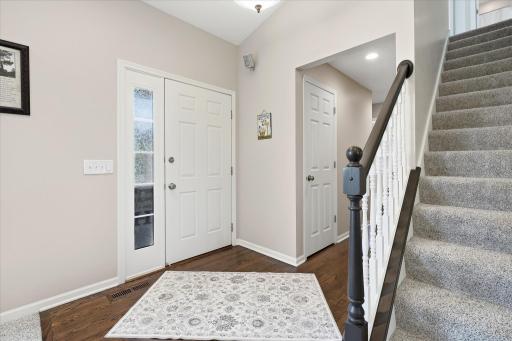 Inviting Entry w/hardwood flooring, closet and open to vaulted Great Room