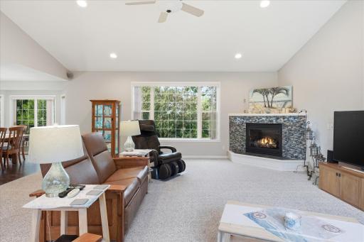 Vaulted Great Rm features gas fireplace w/tile surround, huge windows provides lots of natural light