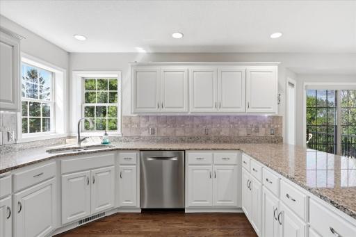 Bosch ss interior dishwasher, Tile backsplash, hardwood floors and satin nickel harware