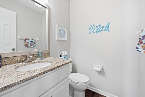 Main Level remodeled Powder Room/Half Bathroom w/wood floors and granite top vanity