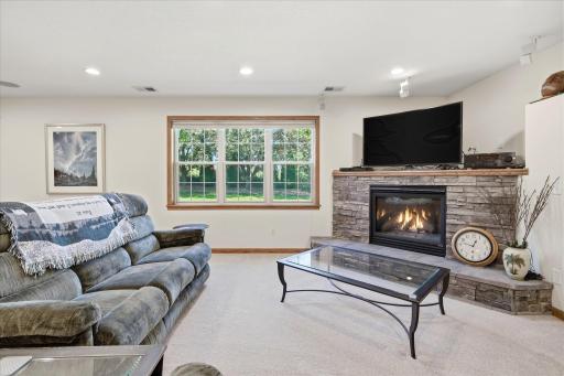 Walkout Family and Game Rooms features gas corner fireplace w/stone surround and LED Recessed lights on dimmers, built-in Bose/JBL speakers