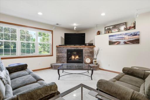Walkout Family and Game Rooms features gas corner fireplace w/stone surround and LED Recessed lights on dimmers, built-in Bose/JBL speakers