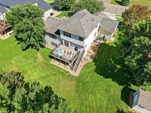 Beautiful landscaping w/paver edging, block retaining walls and lots of perennial plants and shrubs. Numerous landscape lights w/color changing bulbs